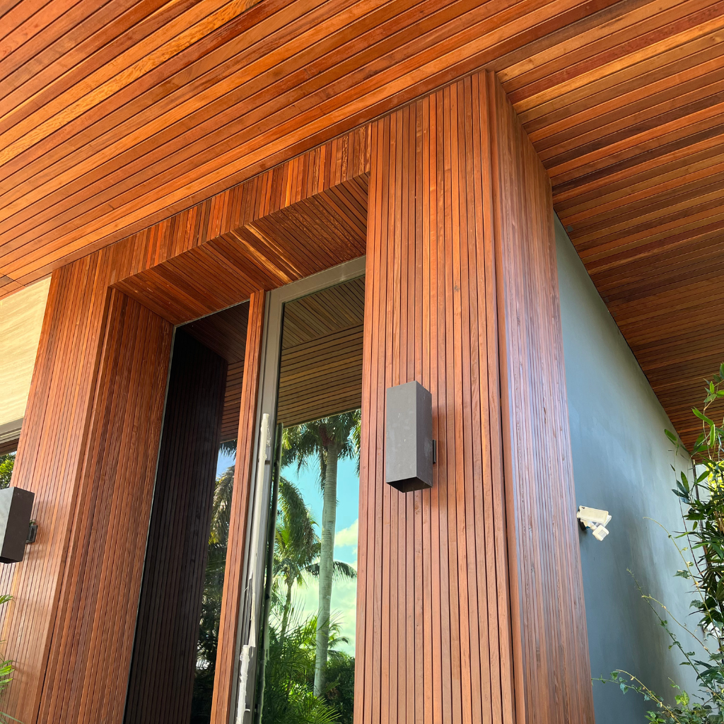 Close-up of narrow Cumaru wood siding and ceiling cladding on modern San Diego home