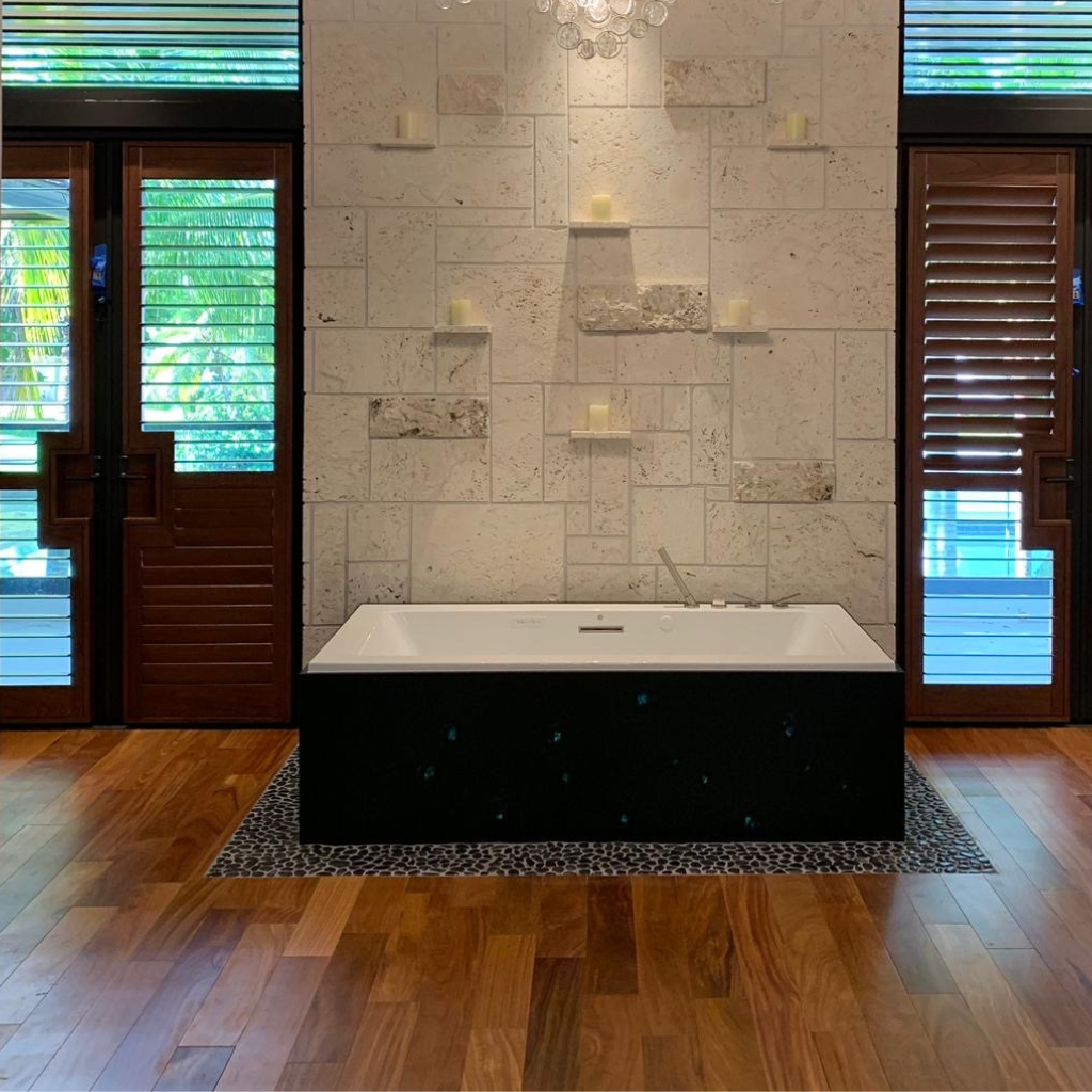 Solid Cumaru hardwood flooring in luxury San Diego bathroom with soaking tub